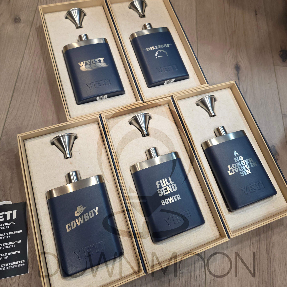 Set of blue Yeti flasks personalized with logos